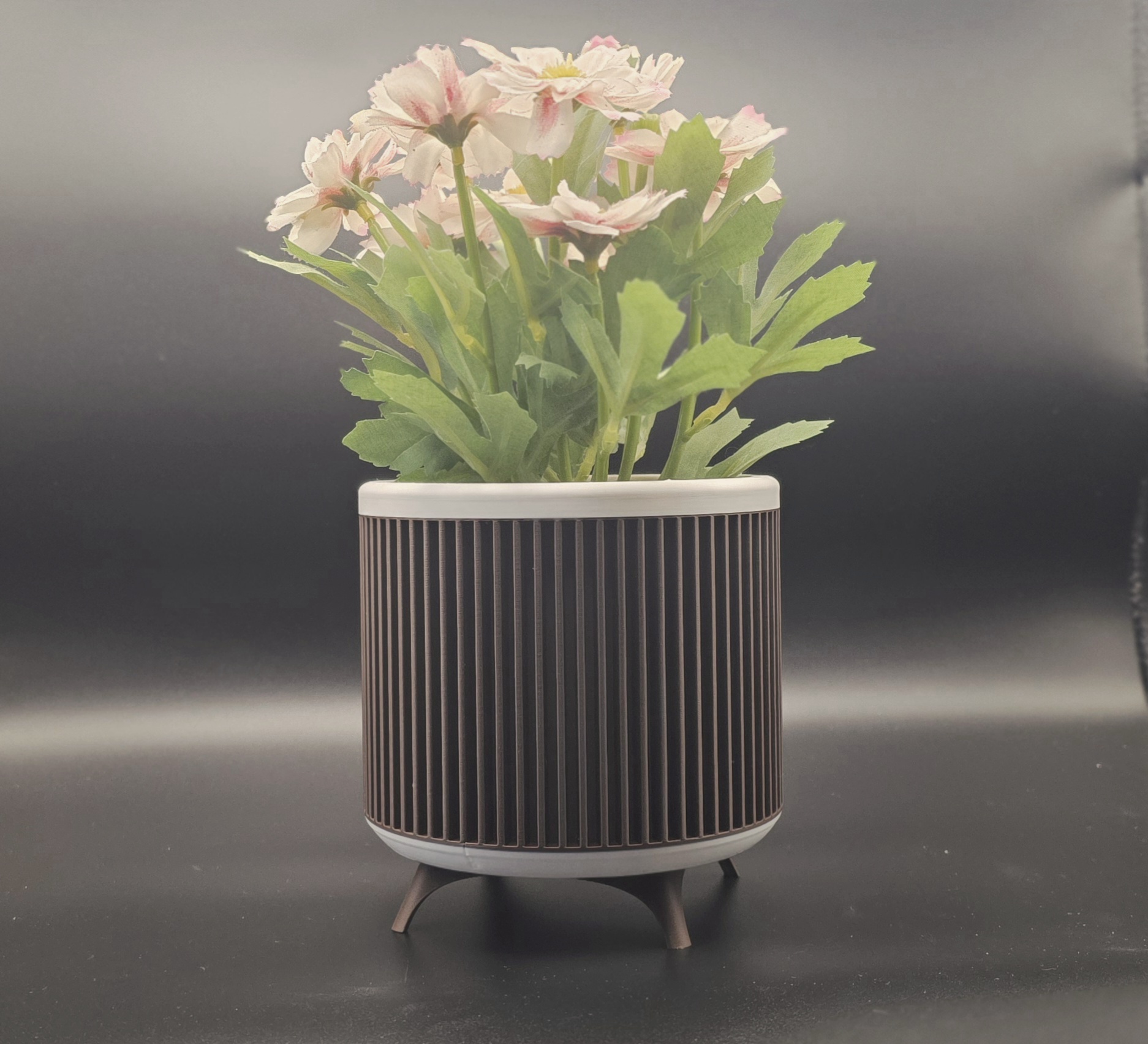 3D printed planter photographed in a home setting